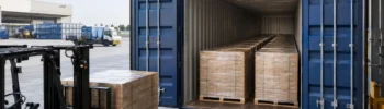 Euro pallets loaded in parallel rows inside a 40ft High Cube Pallet Wide container at a European logistics facility.