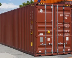 Red shipping container at a depot, with its doors, locking bars and identification markings clearly visible.